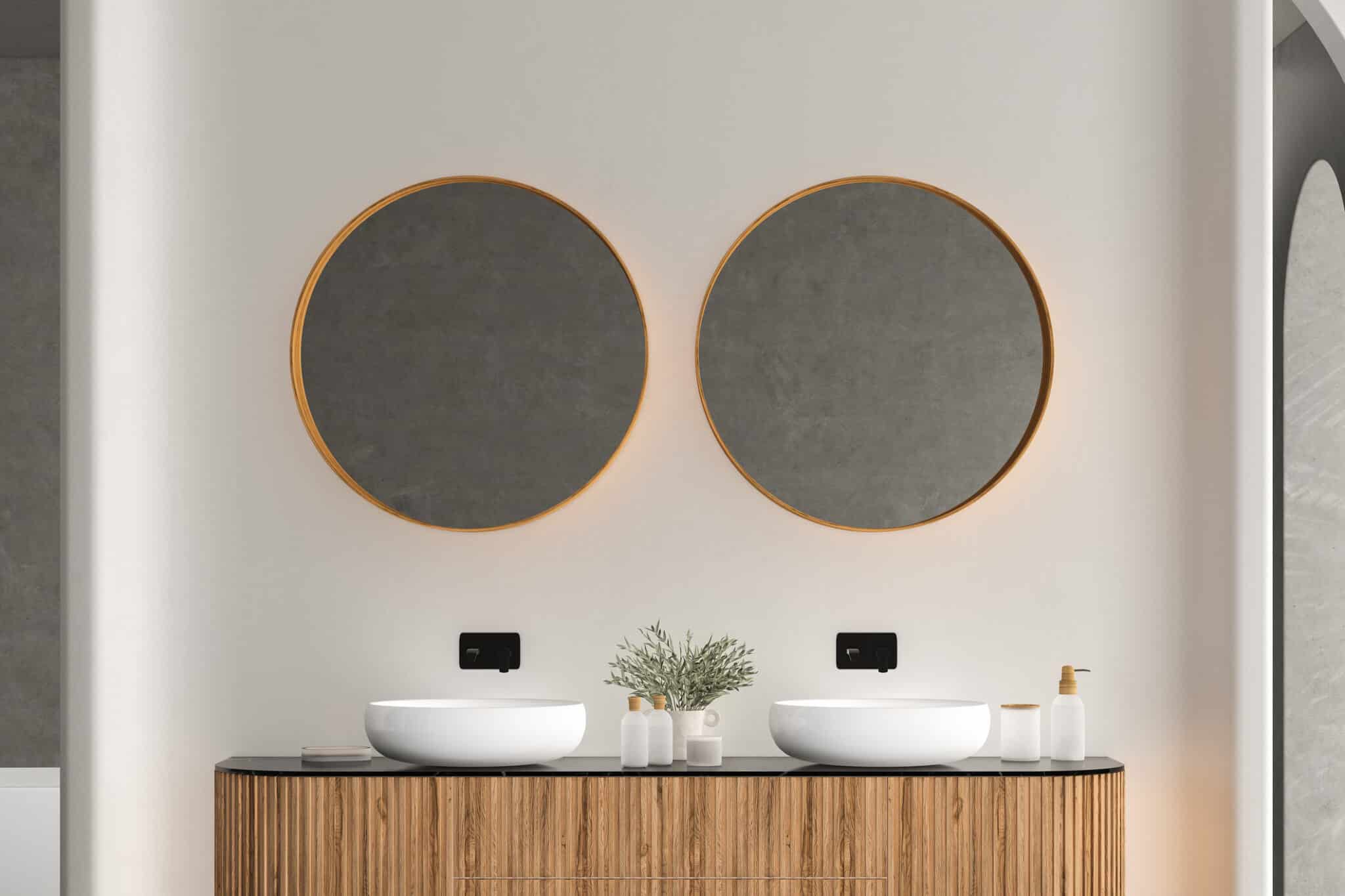 Bright bathroom countertop with white two sinks, front view.