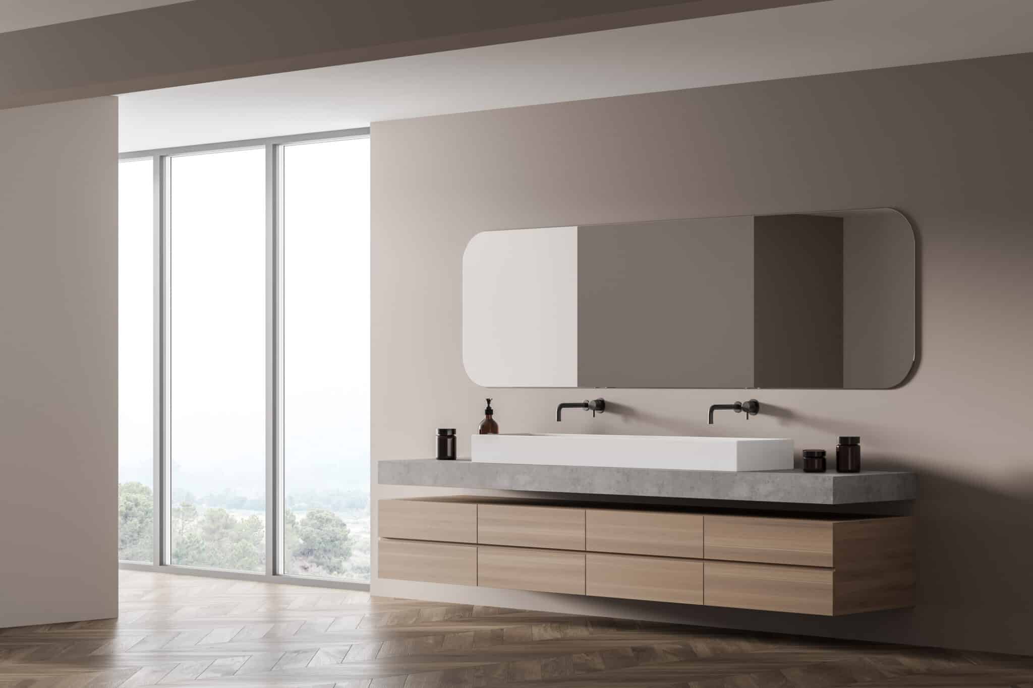 Light wooden bathroom with two sinks and mirror, marble floor