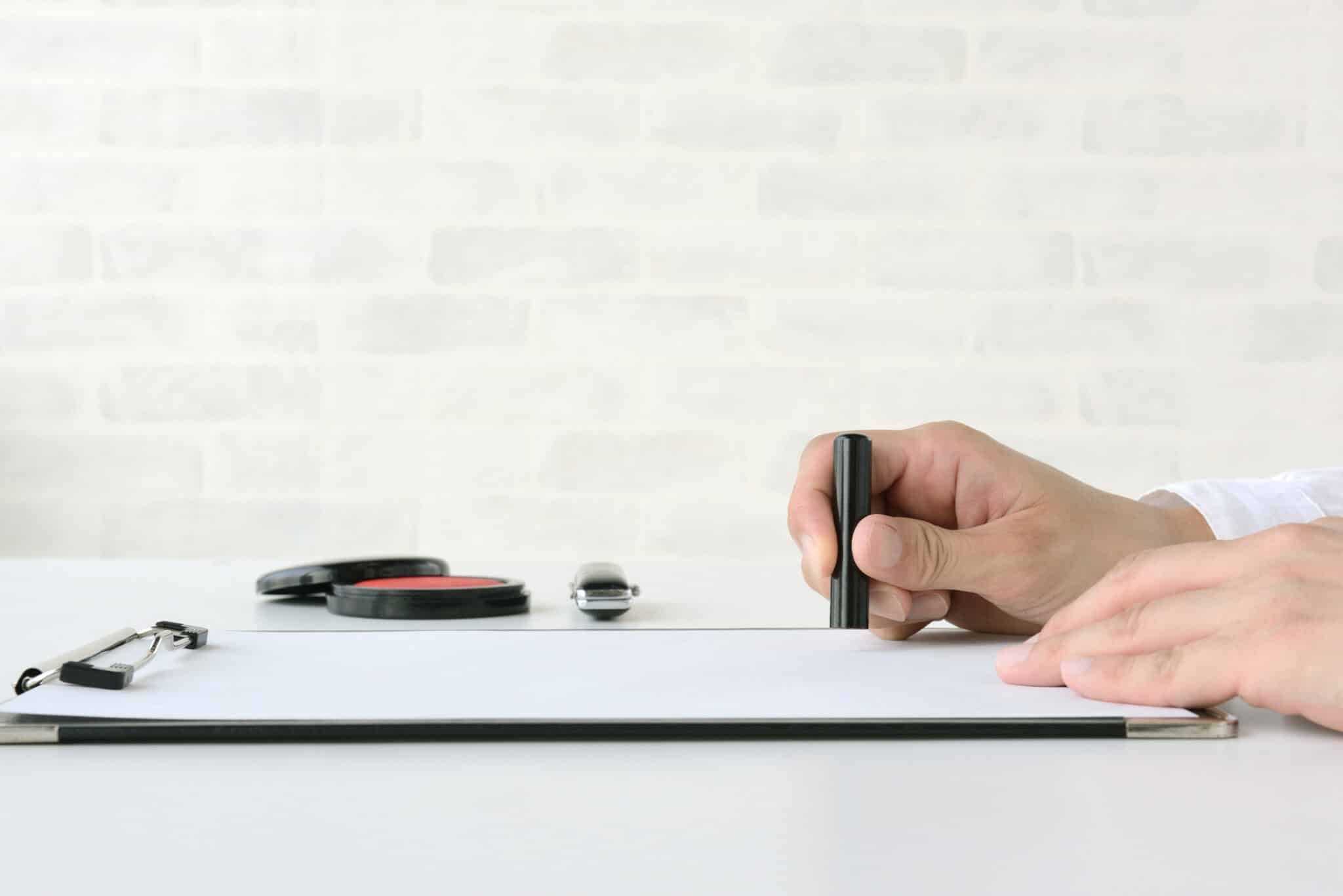 Human's hand using Japanese personal signature stamp